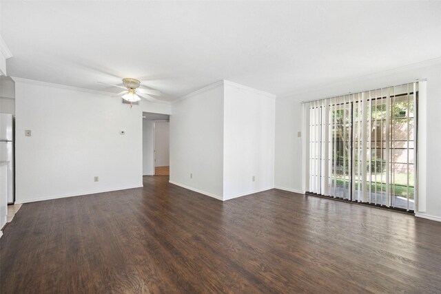 empty room featuring dark wood-style floors, ornamental molding, baseboards, and ceiling fan