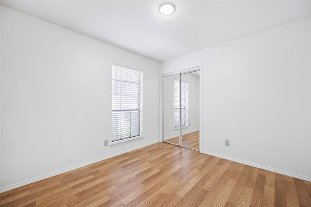 spare room featuring light wood-type flooring