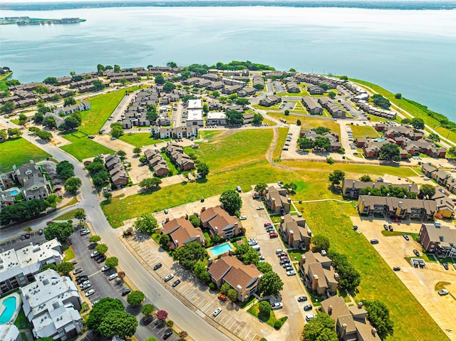 bird's eye view featuring a water view and a residential view