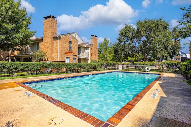 pool featuring fence