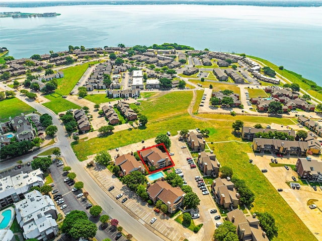 birds eye view of property featuring a water view and a residential view