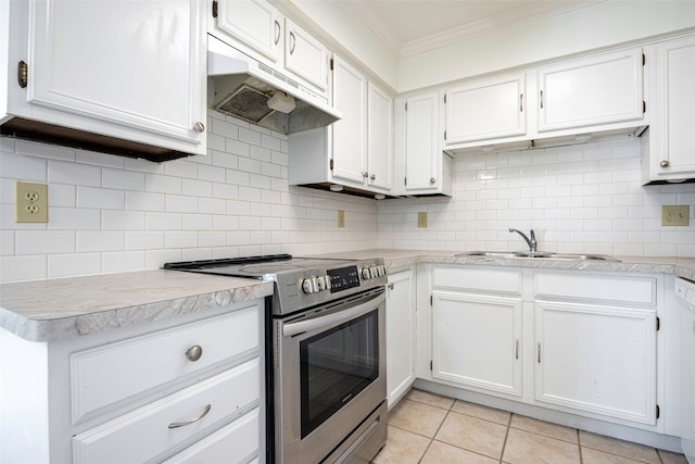 kitchen with stainless steel electric range oven, white cabinets, and decorative backsplash