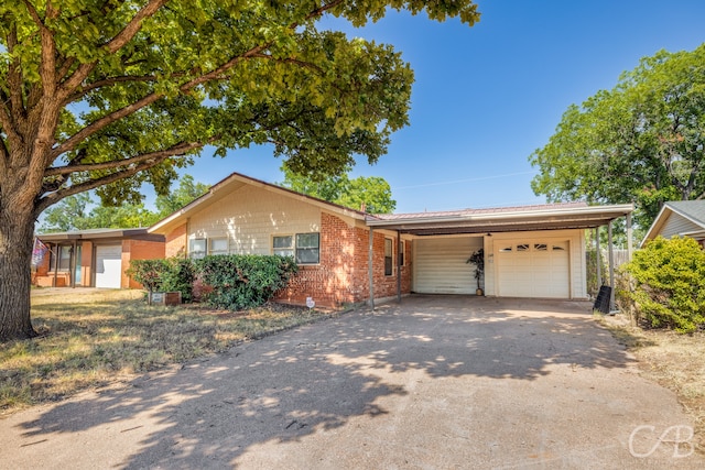 ranch-style house with a carport and a garage