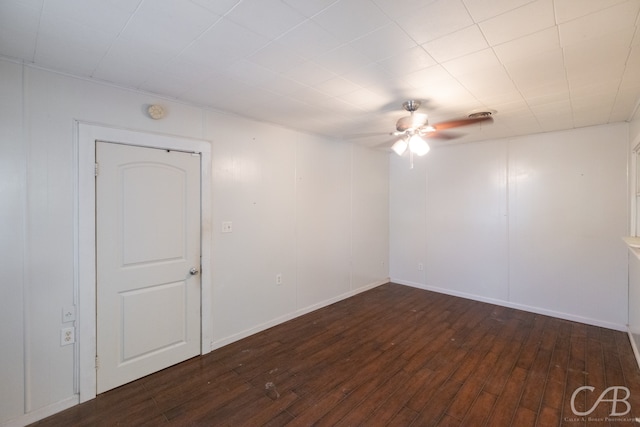 spare room with ceiling fan and wood-type flooring