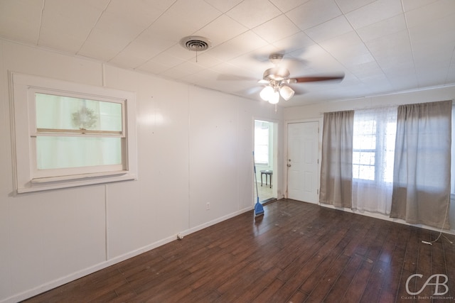 unfurnished room with ceiling fan and hardwood / wood-style flooring