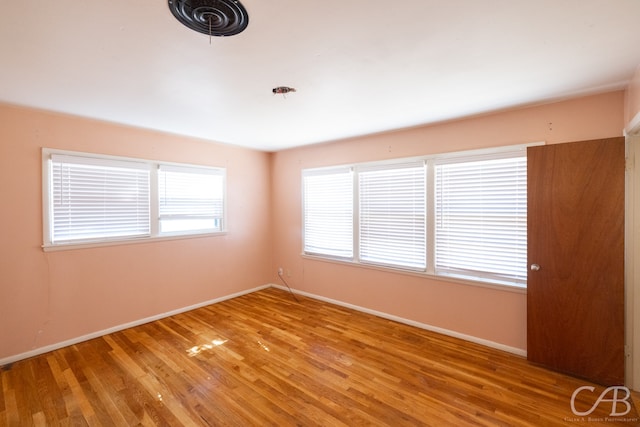 spare room featuring light hardwood / wood-style floors