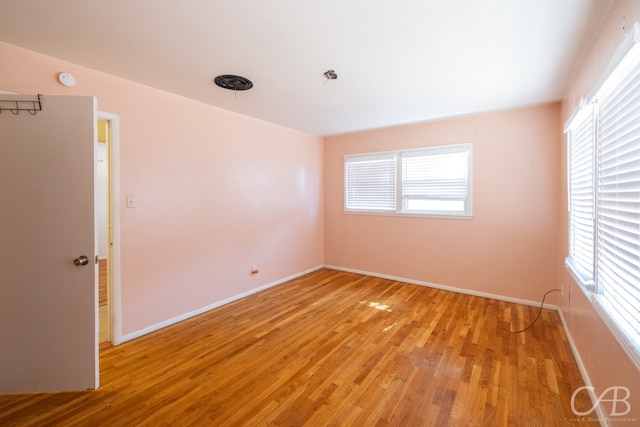 spare room with light wood-type flooring