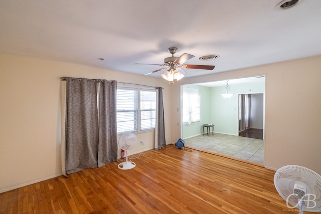 unfurnished bedroom featuring ceiling fan and light hardwood / wood-style flooring