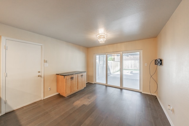 spare room featuring dark hardwood / wood-style floors