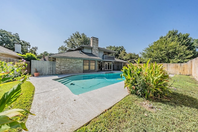 view of swimming pool featuring a patio area, a fenced backyard, and a fenced in pool