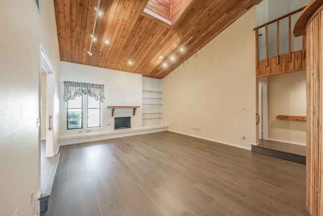 unfurnished living room featuring wood ceiling, wood-type flooring, built in features, and a skylight