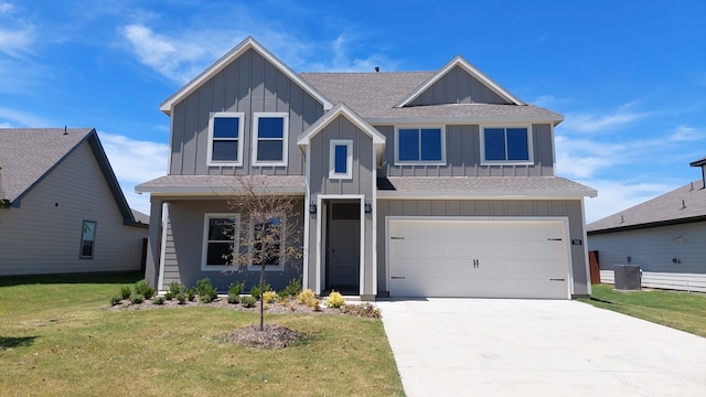 view of front of home featuring a front lawn and a garage