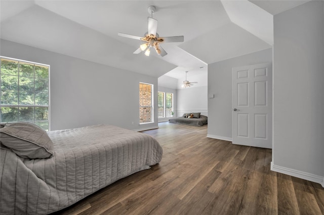 bedroom featuring ceiling fan, baseboards, lofted ceiling, and wood finished floors