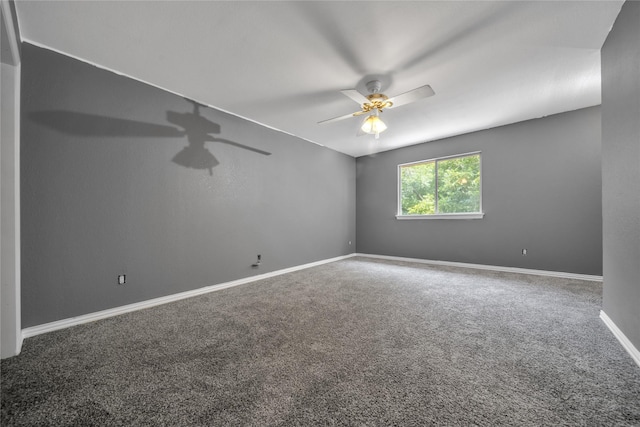 unfurnished room featuring baseboards, carpet floors, and ceiling fan