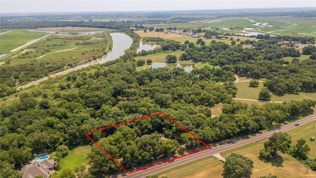 bird's eye view with a rural view and a water view