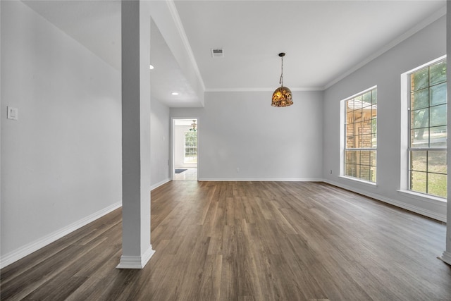 interior space featuring visible vents, ornamental molding, baseboards, and dark wood-style flooring