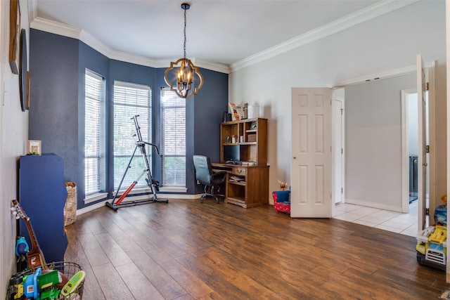 home office with an inviting chandelier, ornamental molding, and hardwood / wood-style flooring