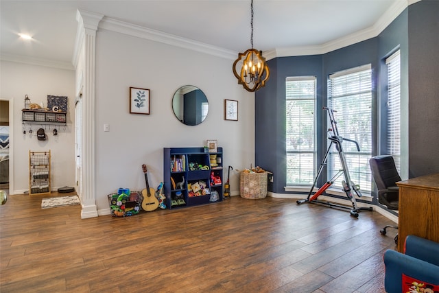 interior space with a chandelier, dark hardwood / wood-style floors, and crown molding