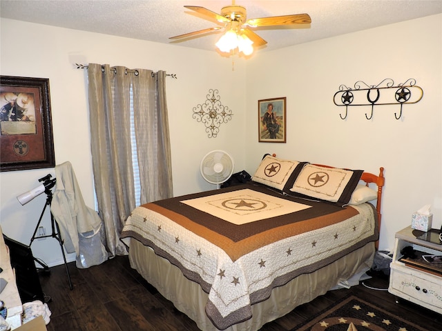 bedroom featuring ceiling fan, hardwood / wood-style flooring, and a textured ceiling