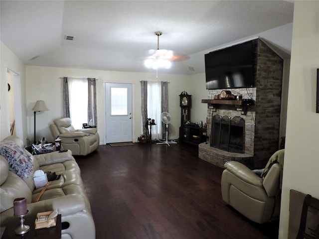 living room with ceiling fan, vaulted ceiling, and hardwood / wood-style flooring