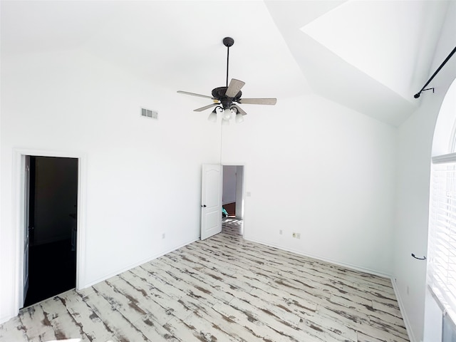 interior space with ceiling fan, light hardwood / wood-style floors, and high vaulted ceiling