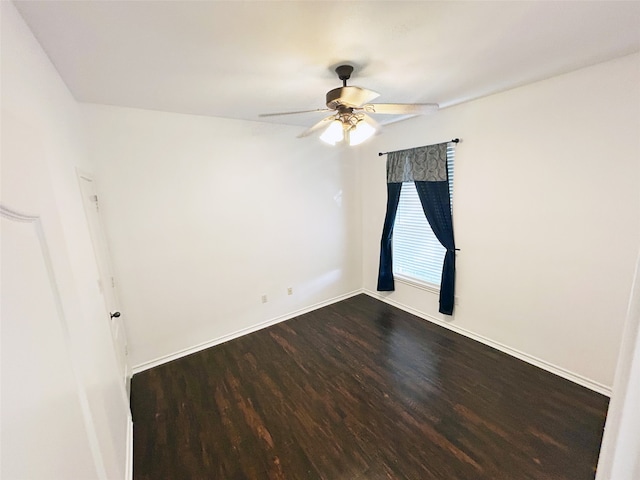 spare room featuring ceiling fan and hardwood / wood-style flooring