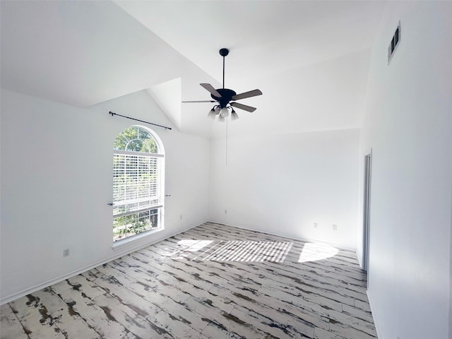 unfurnished room featuring a ceiling fan, visible vents, vaulted ceiling, and wood finished floors