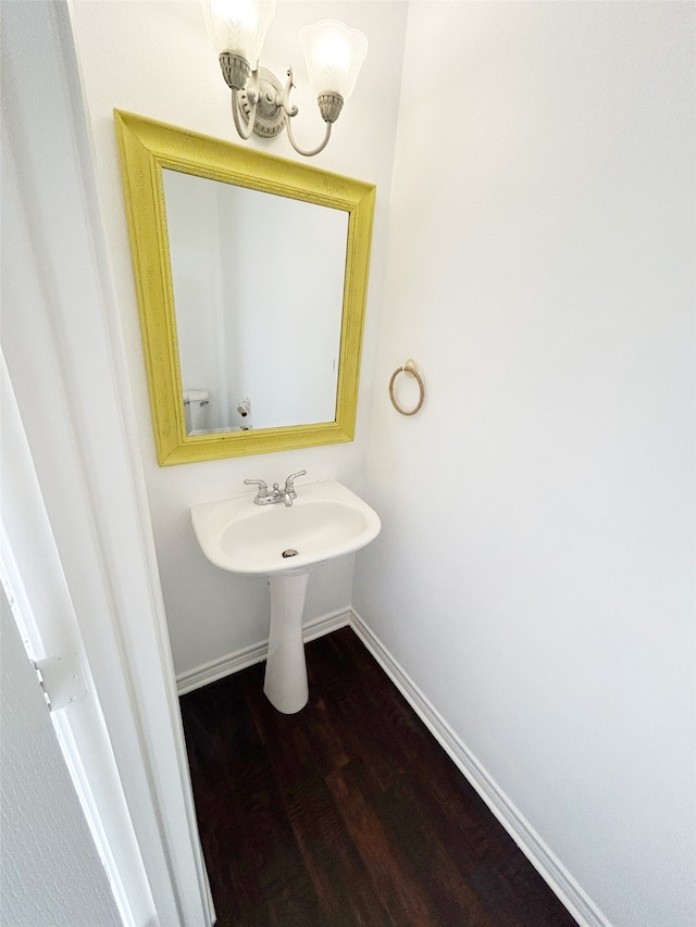 bathroom with hardwood / wood-style floors