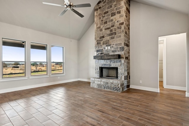 unfurnished living room featuring ceiling fan, high vaulted ceiling, and a fireplace