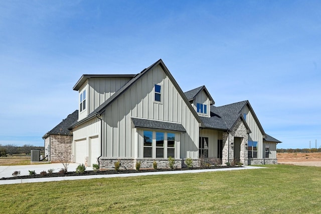 modern farmhouse style home with a front yard, a garage, and central AC