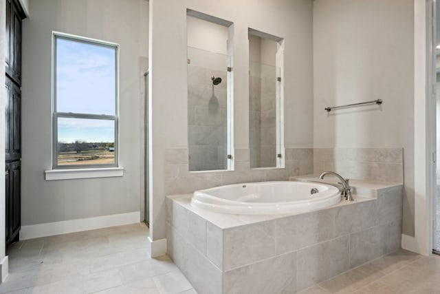 bathroom featuring tile patterned floors and plus walk in shower