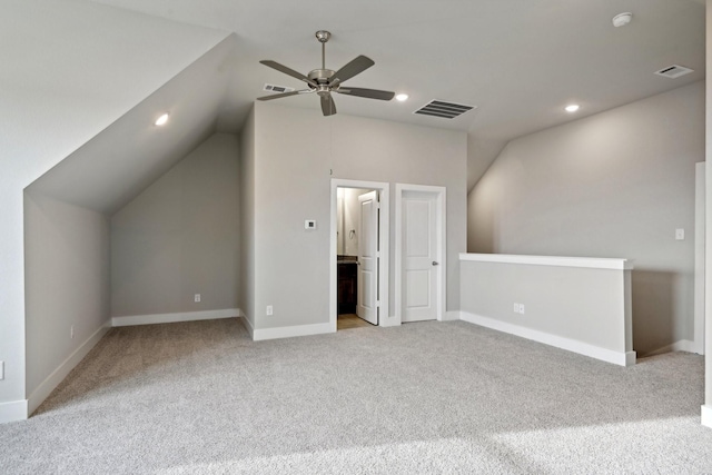 additional living space featuring lofted ceiling, ceiling fan, and light carpet