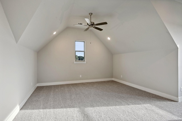 additional living space featuring ceiling fan, lofted ceiling, and carpet floors