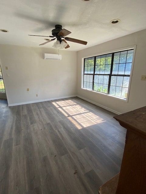 spare room with ceiling fan, dark hardwood / wood-style flooring, and plenty of natural light