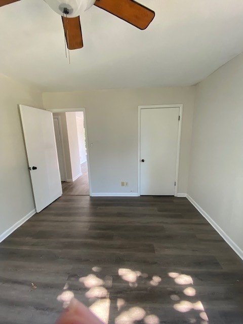 interior space featuring dark hardwood / wood-style floors and ceiling fan