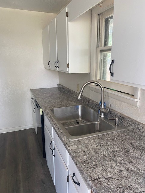 kitchen featuring sink, white cabinetry, dark hardwood / wood-style floors, and dishwasher