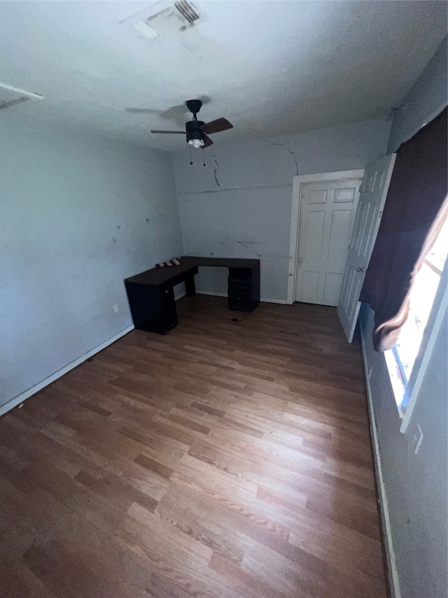 unfurnished living room with ceiling fan and light hardwood / wood-style flooring