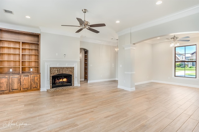 unfurnished living room with crown molding, light hardwood / wood-style floors, and ceiling fan