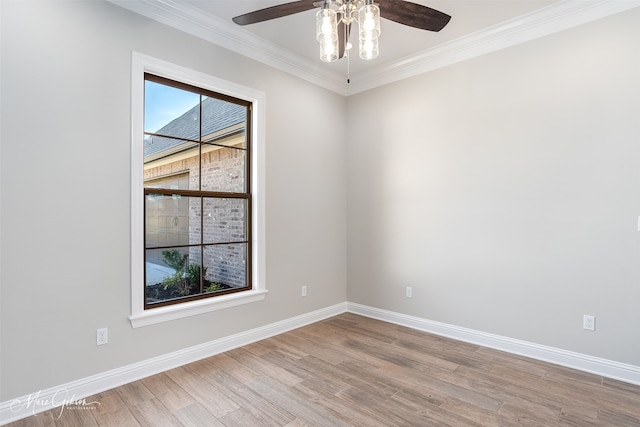 spare room featuring crown molding, light hardwood / wood-style floors, and ceiling fan