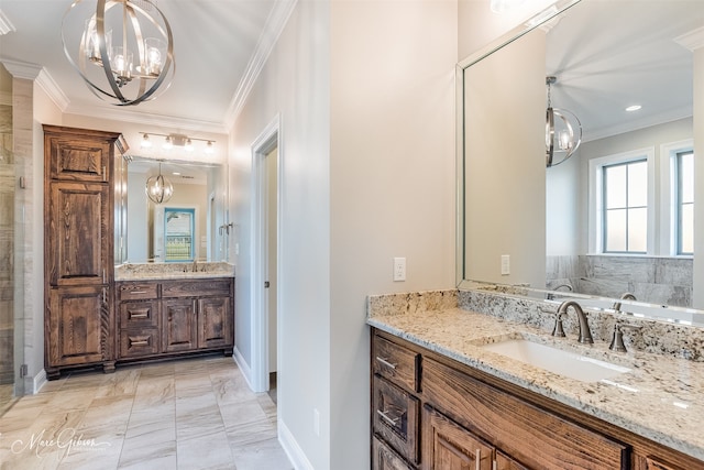 bathroom with ornamental molding, vanity, and a bathing tub