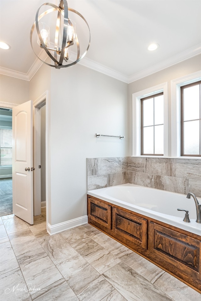 bathroom with ornamental molding, a tub to relax in, and plenty of natural light