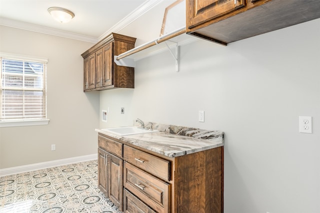 laundry room with washer hookup, sink, cabinets, crown molding, and electric dryer hookup