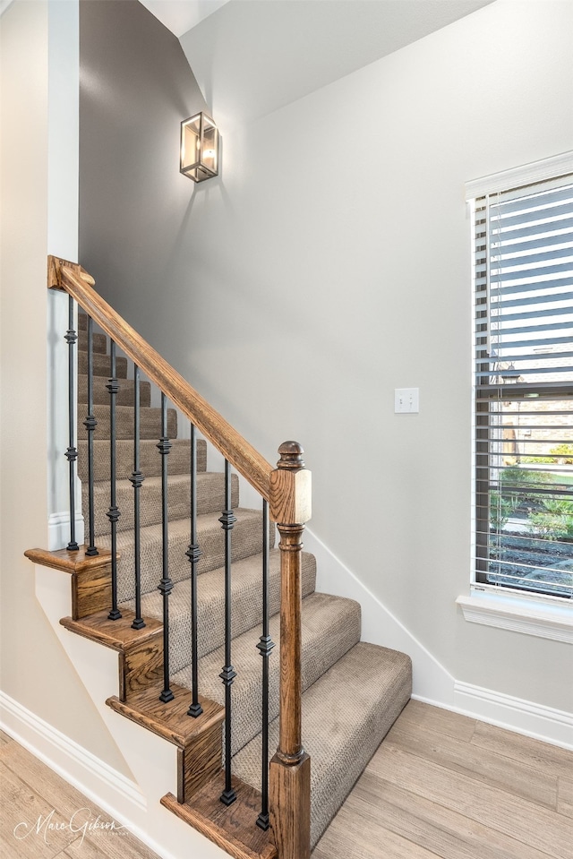 stairway featuring hardwood / wood-style flooring