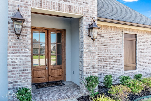 view of exterior entry featuring french doors