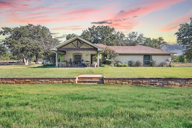 view of front of home with a yard