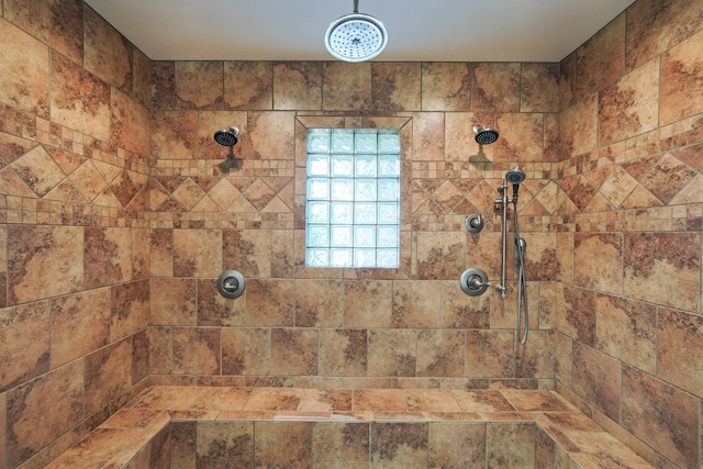 bathroom with tiled shower