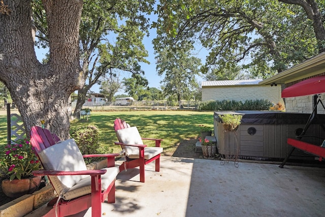 view of patio / terrace with a hot tub