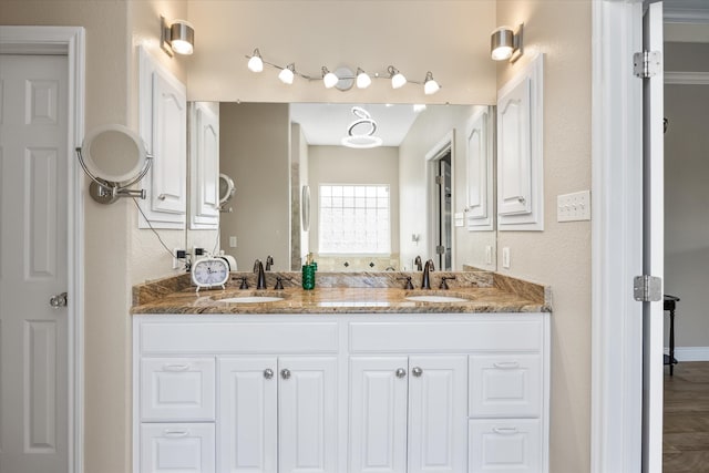 bathroom featuring double sink vanity