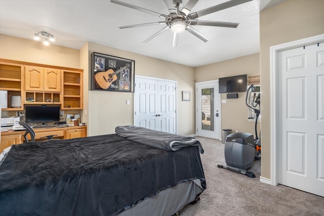 bedroom featuring ceiling fan and light carpet