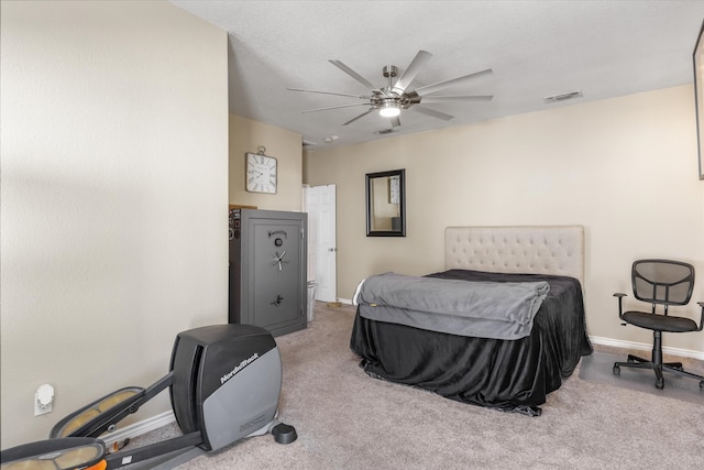 bedroom with ceiling fan and carpet floors